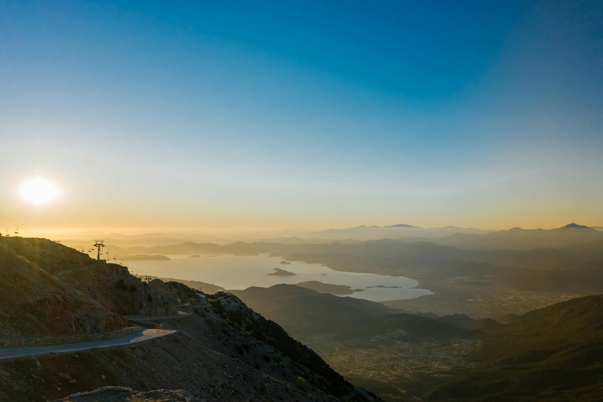 Aerial view of Montenegro mountains and bay water at sunset