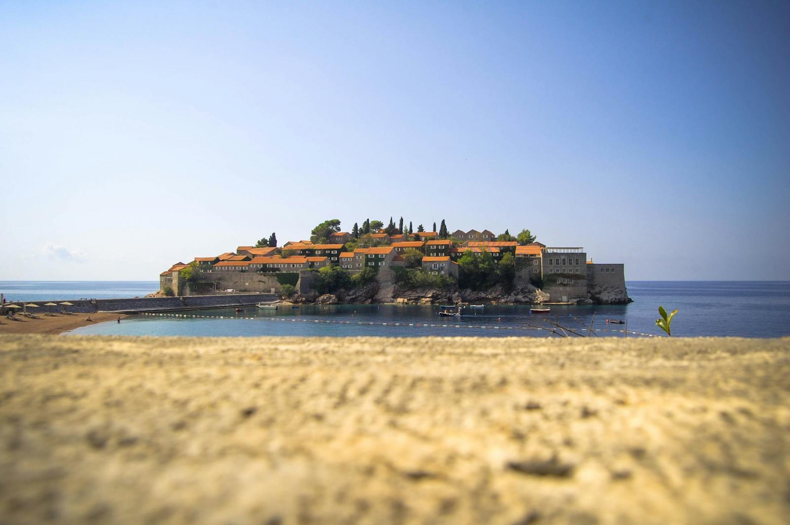 Stone church with terracotta roof on the Montenegrin coast near Reževići, overlooking the Adriatic